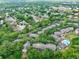 Overhead view of a condo complex surrounded by mature trees and a neighboring residential area at 956 Salt Pond Pl # 207, Altamonte Springs, FL 32714
