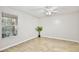 Bright bedroom with wood-look floors, a window, and a ceiling fan at 956 Salt Pond Pl # 207, Altamonte Springs, FL 32714