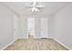 A bright bedroom with wood-look floors and ample closet space at 956 Salt Pond Pl # 207, Altamonte Springs, FL 32714