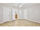Bedroom featuring wood-look floors, a ceiling fan, and an attached bathroom at 956 Salt Pond Pl # 207, Altamonte Springs, FL 32714