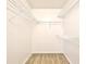 Walk-in closet with shelves and wood-look floors at 956 Salt Pond Pl # 207, Altamonte Springs, FL 32714