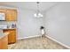 Dining area with a contemporary chandelier and hardwood floors at 956 Salt Pond Pl # 207, Altamonte Springs, FL 32714