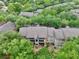 Exterior angle of building surrounded by lush, mature trees, promoting privacy at 956 Salt Pond Pl # 207, Altamonte Springs, FL 32714