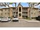 Multi-story building with balconies and well-maintained landscaping at 956 Salt Pond Pl # 207, Altamonte Springs, FL 32714