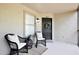 Cozy condo patio with seating and natural light at 956 Salt Pond Pl # 207, Altamonte Springs, FL 32714