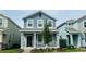 Charming two-story home features a covered front porch and well-maintained landscaping at 11296 Listening Dr, Orlando, FL 32832