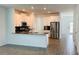 Modern kitchen features stainless steel appliances, granite countertops, and ample cabinet space at 11296 Listening Dr, Orlando, FL 32832