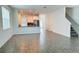 Bright and spacious open-concept living area adjacent to modern kitchen at 11296 Listening Dr, Orlando, FL 32832