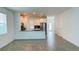 Open-concept living area with tile floors connecting to kitchen, great for entertaining at 11296 Listening Dr, Orlando, FL 32832