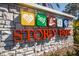 Stone sign for Storey Park featuring colorful icon art on stone pillar base at 11296 Listening Dr, Orlando, FL 32832