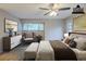 Virtually staged main bedroom with updated flooring, large windows, and neutral color palette at 121 Primrose Dr, Longwood, FL 32779