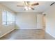 This bedroom is bright and airy, with a ceiling fan and large window at 121 Primrose Dr, Longwood, FL 32779