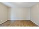 Empty bedroom features hardwood floors, neutral walls, and base trim at 121 Primrose Dr, Longwood, FL 32779