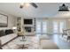 Bright living room with fireplace, built-in shelves, neutral tones, and access to the outdoor at 121 Primrose Dr, Longwood, FL 32779