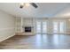 Open living room featuring a fireplace, built-in shelving, and access to the outdoor at 121 Primrose Dr, Longwood, FL 32779