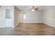 Spacious living room with hardwood floors, neutral tones, and built in shelves at 121 Primrose Dr, Longwood, FL 32779
