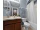 Bathroom with vanity, toilet, tub, and blue paint at 16064 Old Ash Loop, Orlando, FL 32828