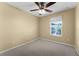Bedroom featuring neutral walls, carpet, and a window bringing in natural light at 16064 Old Ash Loop, Orlando, FL 32828