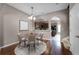 Dining room with hardwood floors and modern lighting fixtures at 16064 Old Ash Loop, Orlando, FL 32828