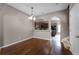 Dining room with hardwood floors and view to the kitchen at 16064 Old Ash Loop, Orlando, FL 32828