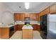 Spacious kitchen with ample counter space, cabinetry, and modern appliances at 16064 Old Ash Loop, Orlando, FL 32828