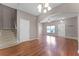 Open-concept living room with a staircase and entry area at 16064 Old Ash Loop, Orlando, FL 32828