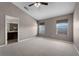 Main bedroom featuring carpet flooring, neutral paint, and a ceiling fan at 16064 Old Ash Loop, Orlando, FL 32828