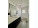 Updated bathroom with a sleek vanity, modern fixtures, and a bathtub at 1690 Palm Ave, Winter Park, FL 32789