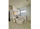 Bright bathroom featuring a soaking tub with marble tile surround and a glass enclosed shower at 1690 Palm Ave, Winter Park, FL 32789