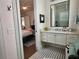 Bathroom with white cabinets and a black and white tiled floor at 1690 Palm Ave, Winter Park, FL 32789