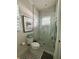 Bathroom with toilet and glass enclosed shower at 1690 Palm Ave, Winter Park, FL 32789