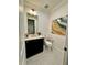 Stylish powder room with a modern vanity, decorative mirror, and chic accents at 1690 Palm Ave, Winter Park, FL 32789
