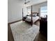 Bright primary bedroom featuring dark hardwood flooring and a large area rug at 1690 Palm Ave, Winter Park, FL 32789