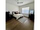 Well-lit bedroom with hardwood floors and a clean, minimalist design at 1690 Palm Ave, Winter Park, FL 32789