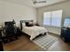 Well lit bedroom with hardwood floors, a ceiling fan, and a large window at 1690 Palm Ave, Winter Park, FL 32789