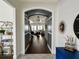 Stylish foyer featuring dark hardwood floors, elegant archway, and modern decor at 1690 Palm Ave, Winter Park, FL 32789
