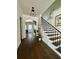 Inviting foyer with hardwood floors, staircase, and decorative lighting at 1690 Palm Ave, Winter Park, FL 32789
