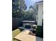 Private hot tub area surrounded by lush landscaping and fencing at 1690 Palm Ave, Winter Park, FL 32789