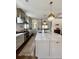 Spacious kitchen with stainless steel appliances, marble countertops, and pendant lighting at 1690 Palm Ave, Winter Park, FL 32789
