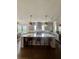 Bright kitchen features an island with seating, stainless steel appliances, and hanging pendant lights at 1690 Palm Ave, Winter Park, FL 32789