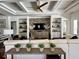 Relaxing living room with coffered ceilings and neutral decor, centered around a media center at 1690 Palm Ave, Winter Park, FL 32789