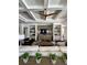 Inviting living room features a stone accent wall, coffered ceiling, and stylish decor at 1690 Palm Ave, Winter Park, FL 32789