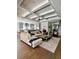 Open-concept living room featuring modern furnishings and hardwood floors at 1690 Palm Ave, Winter Park, FL 32789