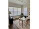 Office space with a white desk, black accents, and natural lighting at 1690 Palm Ave, Winter Park, FL 32789