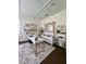 Bright office space with a white desk, gold accents, and decorative mirror at 1690 Palm Ave, Winter Park, FL 32789