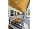 Spacious outdoor living area with a lounge area, dining space, and outdoor kitchen at 1690 Palm Ave, Winter Park, FL 32789