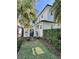 Side yard featuring a lush green lawn and gated entrance at 1690 Palm Ave, Winter Park, FL 32789
