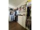 Walk-in closet with custom shelving and hardwood floors at 1690 Palm Ave, Winter Park, FL 32789