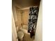 Standard bathroom featuring a tub/shower combination with a floral shower curtain at 4350 Aqua Vista Dr # G, Orlando, FL 32839