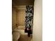 Standard bathroom featuring a tub/shower combination with a floral shower curtain at 4350 Aqua Vista Dr # G, Orlando, FL 32839